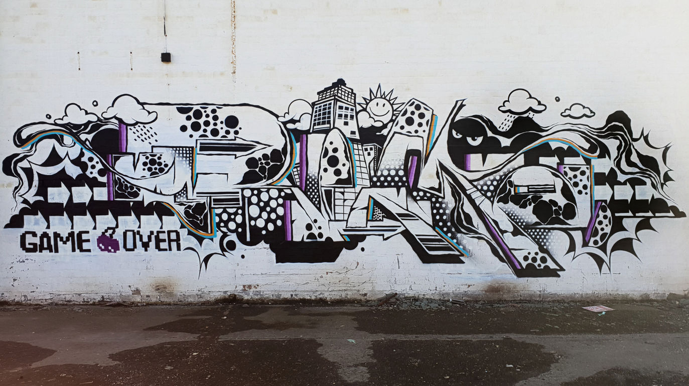 Black and white coloured graffiti spray painted onto a wall in a derelict building by Mef Remo HBR Hated But Rated crew