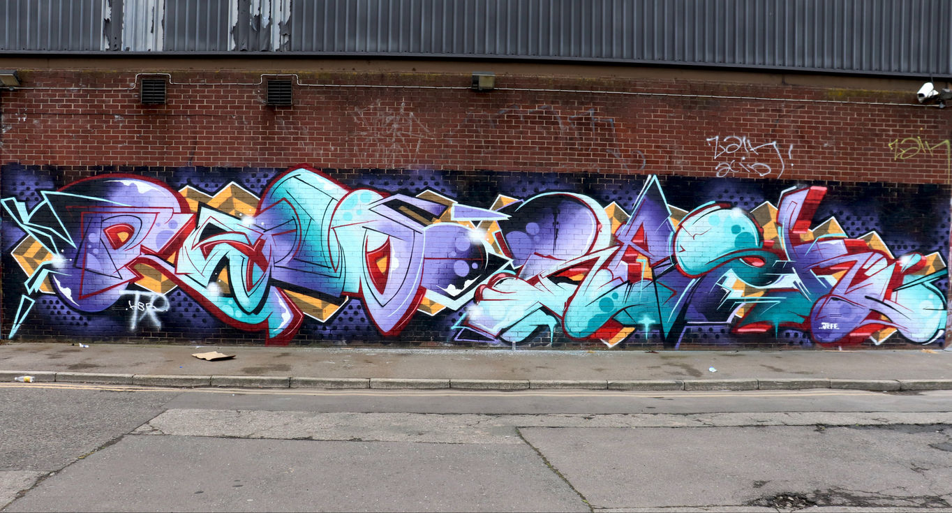 Multi coloured stylish graffiti letters spray painted onto a wallby writer artist Mef Remo and Rask HBR Hated But Rated crew