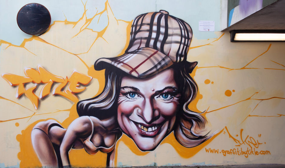 An unflattering spray painted caricature of TV personality Katie Hopkins wearing a Burberry cap