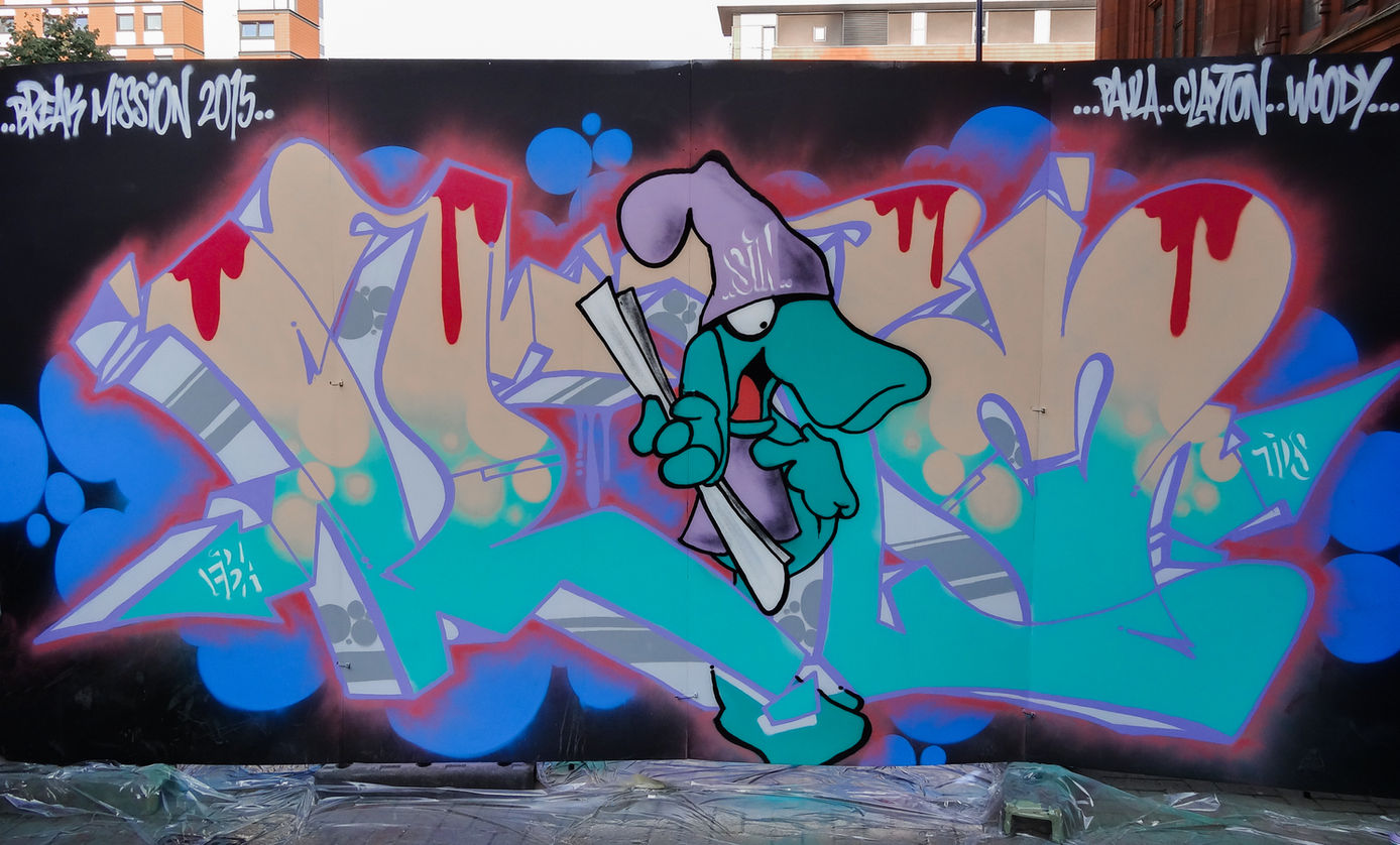 Pastel coloured 3D graffiti letters featuring a lizard character holding a scroll