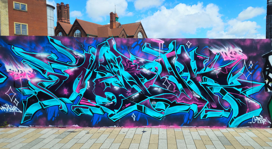 Some amazing graffiti letters that use the colours turquoise, blue and black