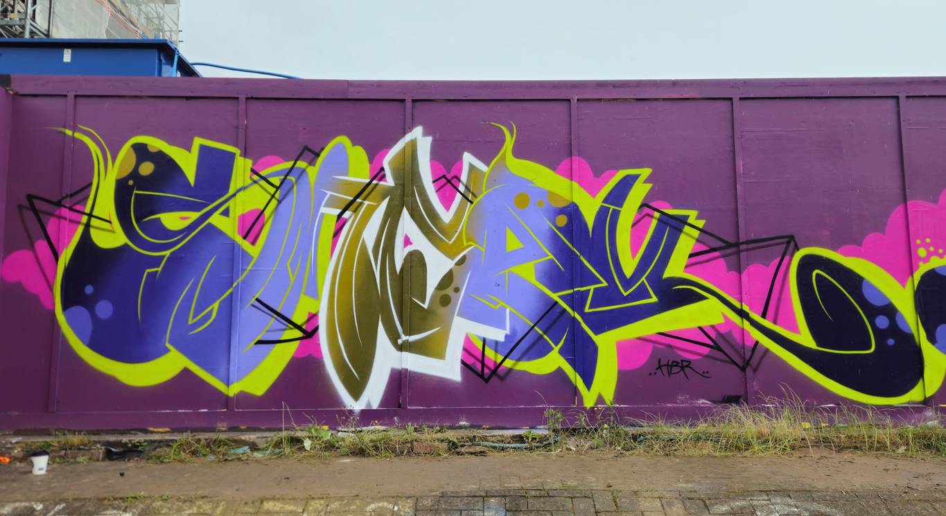 Brightly coloured graffiti lettering that says "Sneak" painted by Mef Remo HBR Hated But Rated crew