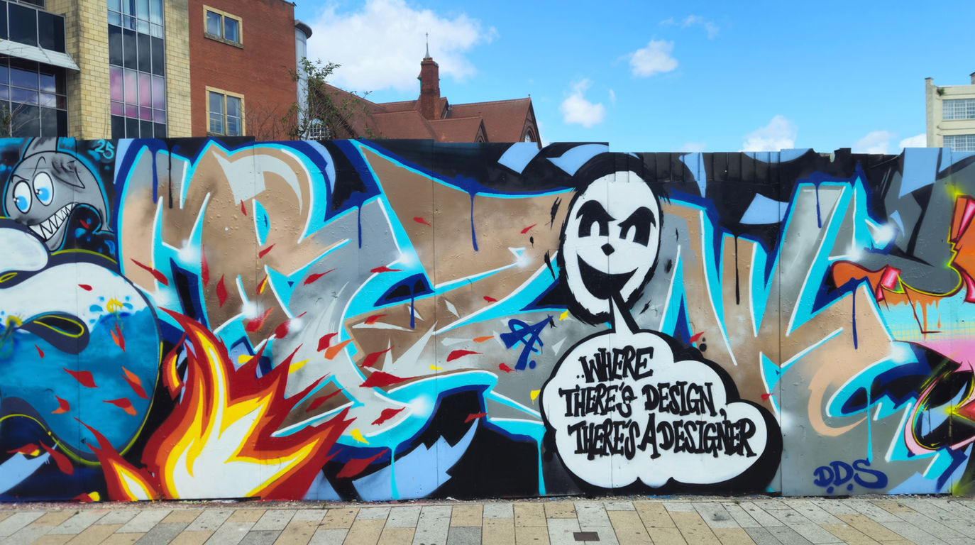 Graffiti letters, featuring flames and a face, spray painted by writer artist Mr Zonk DDS in Birmingham