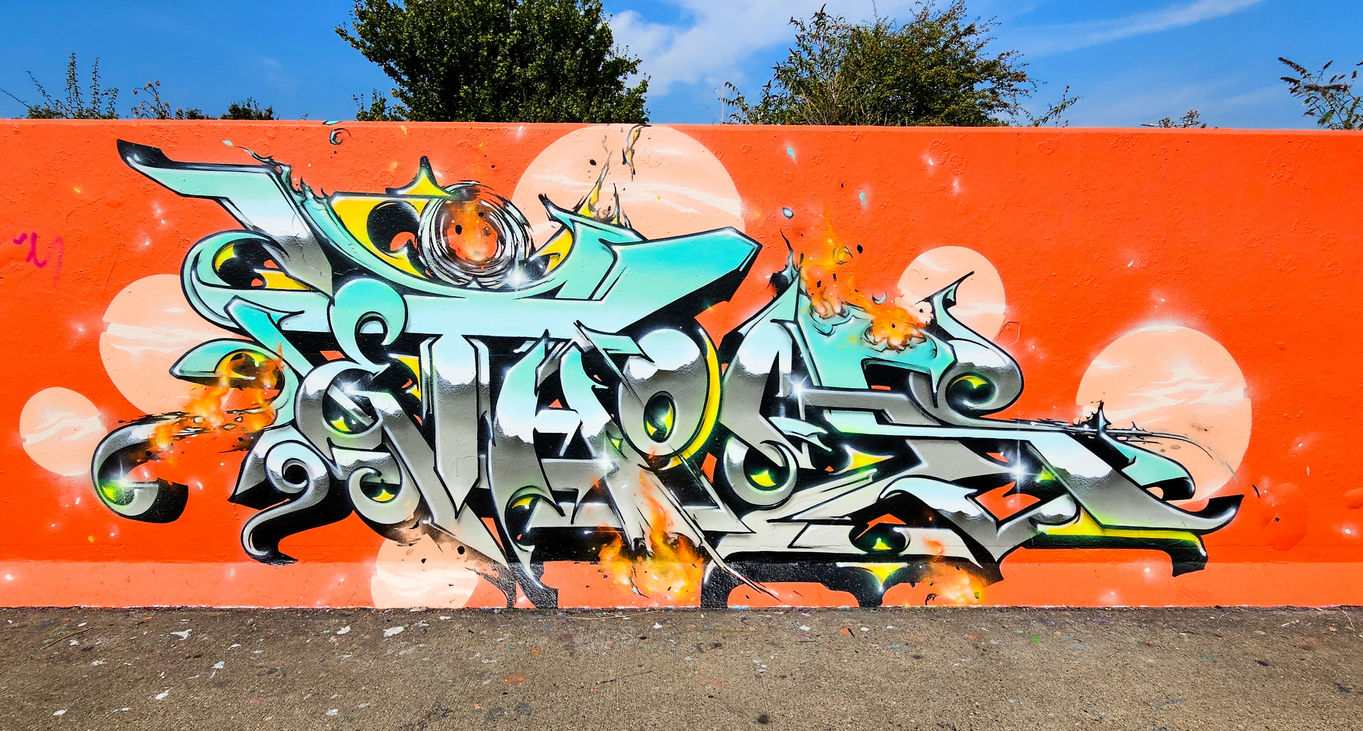 Amazing and stylish graffiti letters painted onto an orange background