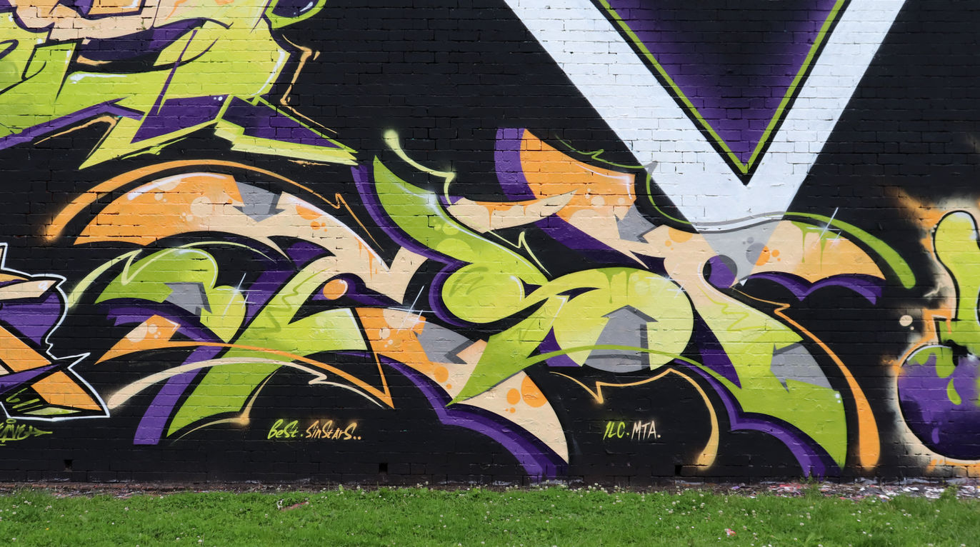 Lime green, orange and yellow graffiti letters that say "Best".