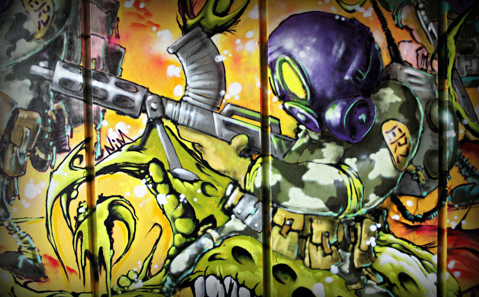 A graffiti character, wearing a gas mask and rucksack, firing a large machine gun