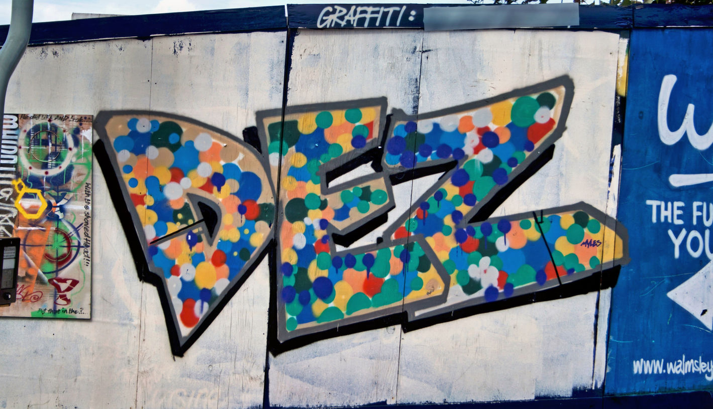 Very simple looking graffiti letters with dots of spray paint to fill it in by Dez Desire TWC