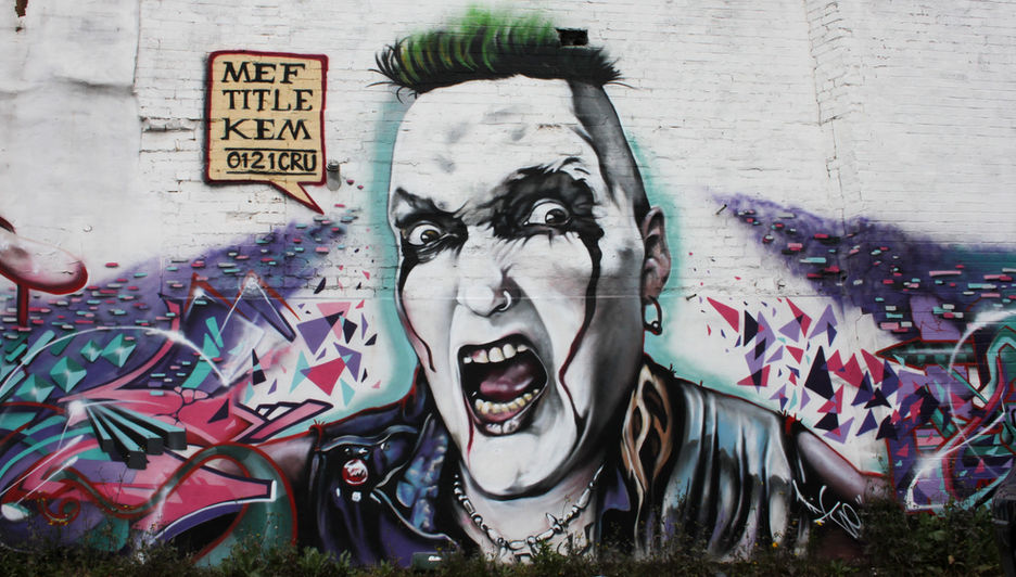 A realistic spray painted image of a punk with green hair and black make-up