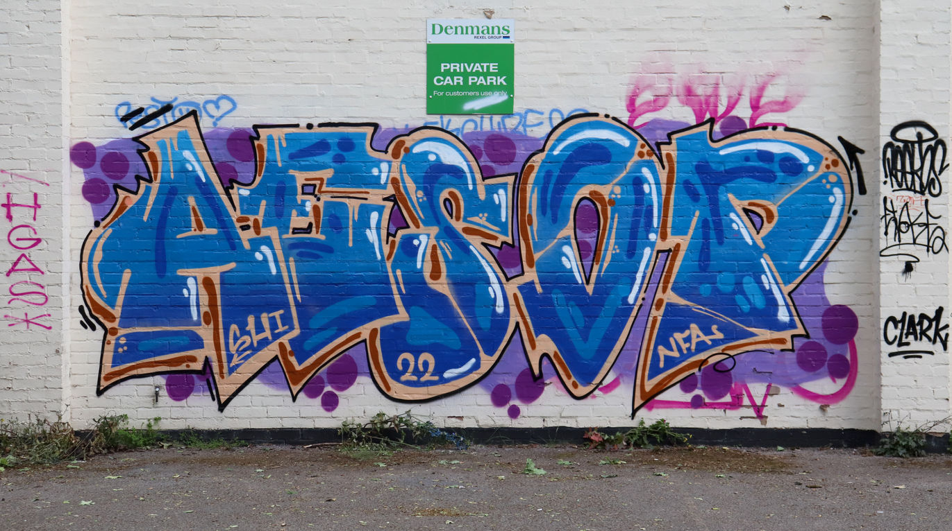 A blue and orange piece of graff in Leicester, UK