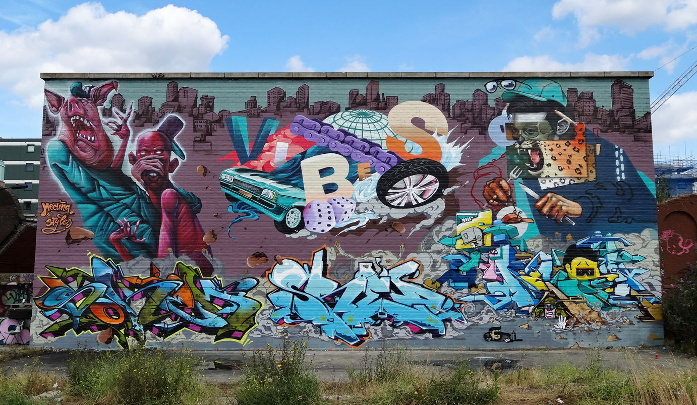 A huge wall of graffiti featuring letters and characters, spray painted in Shoreditch, London