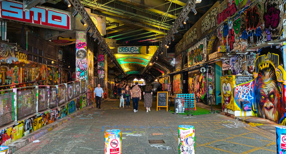A very colourful graffiti and street art painted tunnel in London, UK