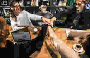 Group of young adults hands in the middle