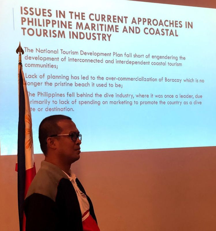 Mr. Jesse Pascasio, Director for Strategic Planning and Communications of National Coast Watch Council Secretariat discussing the National Marine Policy during the Maritime Forum held at the Admiral Hall of the Lighthouse Marina Resort