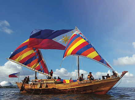 The Balangay called Sultan Si Sulud with the Philippine Flag in Manila Bay