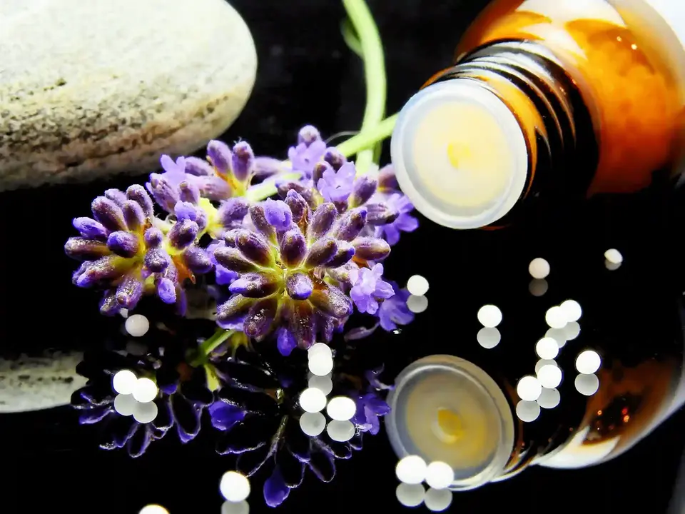 Homeopathic globules a glass bottle and a flower