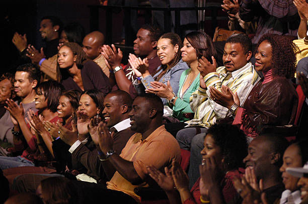 Audience clapping and laughing during LAFFAPALOOZA! in Atlanta, Georgia.