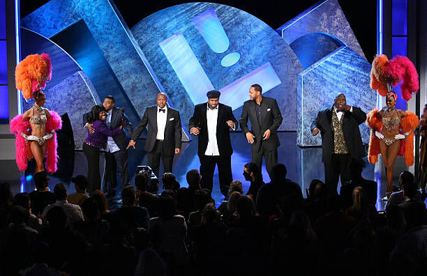 Comedians Sheryl Underwood, Tracy Morgan, Earthquake, Corey Holcomb, Mark Curry and Lavell Crawford stand on stage at LAFFAPALOOZA! presented by TBS at Caesars Palace in Las Vegas, Nevada.