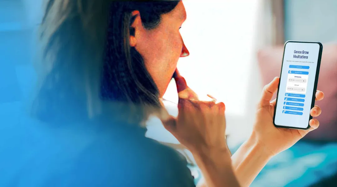 A woman using the Genos Grow meditation app on her phone, highlighting personal growth and emotional intelligence tools.