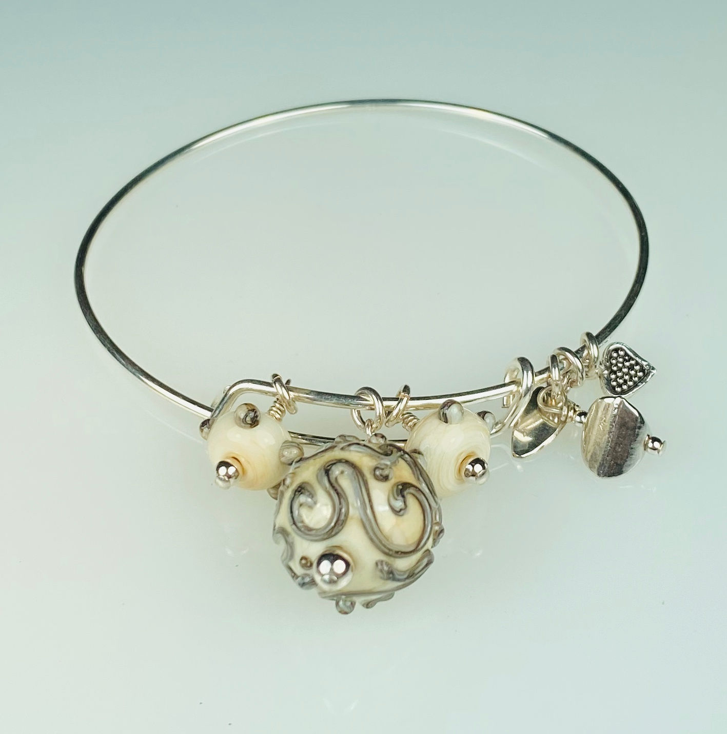 B069 A & A Bracelet Ivory Round Bead w/Silvered Ivory Trim