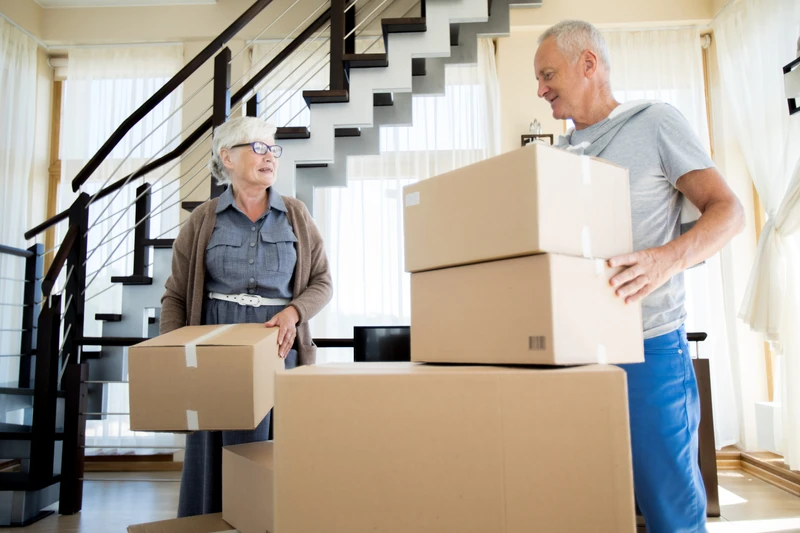 Adults boxing possessions for a move ahead.