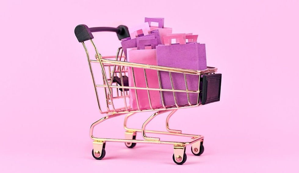 Image of a shopping trolley with shoppping bags in a fun purple and pink hue.