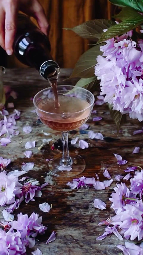 Thumbnail: anima mundi calm tea in a cocktail glass with flowers