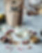 white bag of anima mundi herbal tea with herbal glass tea cup and petals