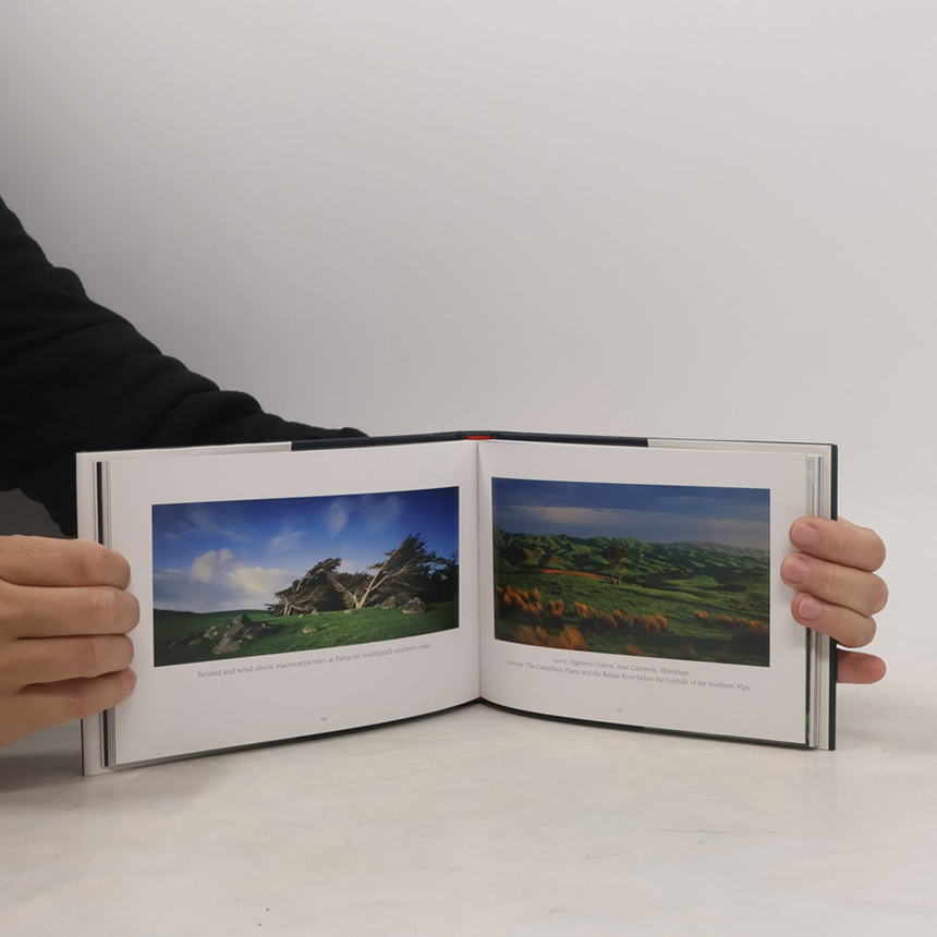 Open New Zealand Landscapes book showing panoramic photographs of Aotearoa’s mountains, lakes and natural scenery.