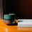 Thumbnail: teal and slate coloured glazed vintage candle next to a book