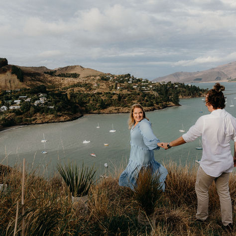 Stef & Fraser exploring the hills above Lyttelton Harbour during their Christchurch engagement shoot.