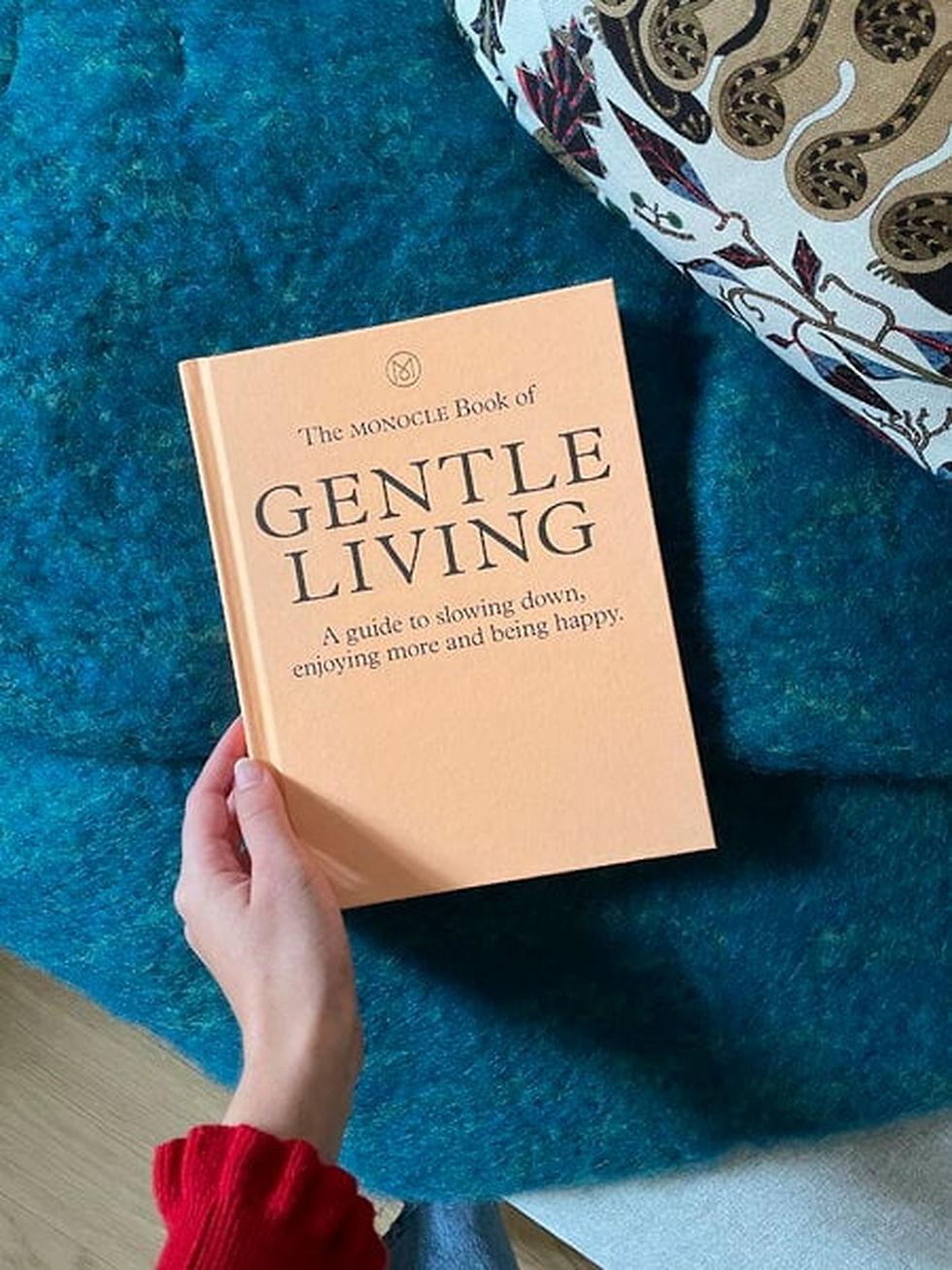 Peach hardcover The Monocle Book of Gentle Living with black serif title text.