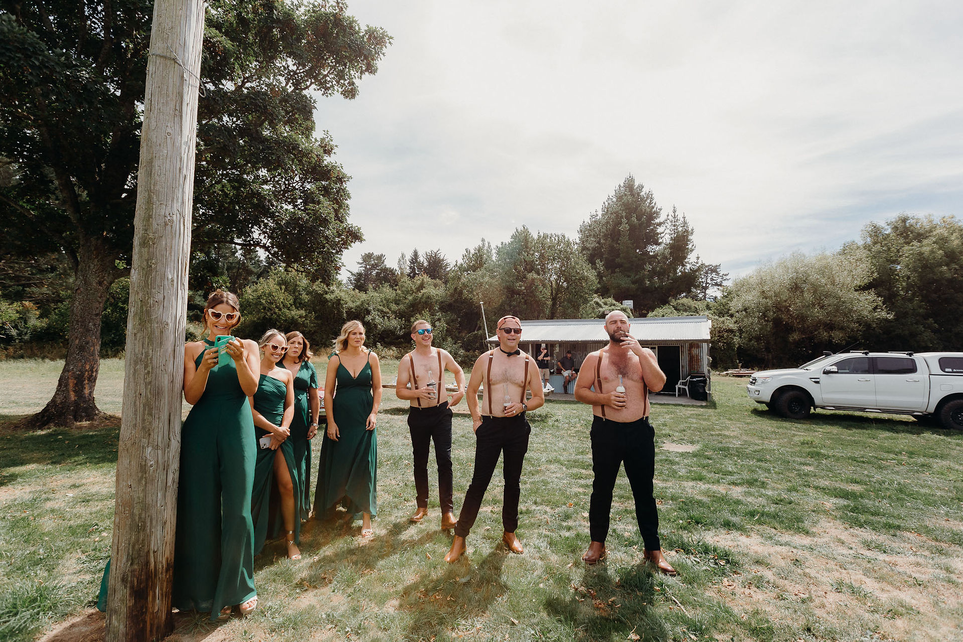 Bride and groom clay bird shooting with their bridal party before the wedding ceremony
