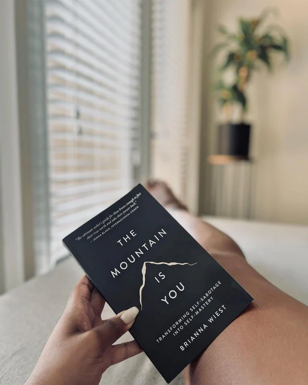 Thumbnail: black front cover with outline of mountain of book called the mountain is you