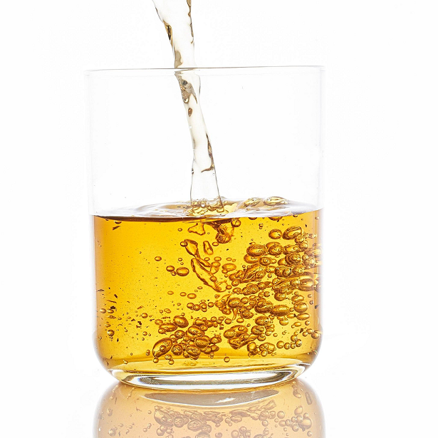 Thumbnail: Golden tea being poured into a glass, with bubbles rising to the surface, capturing the freshness and clarity of the drink.