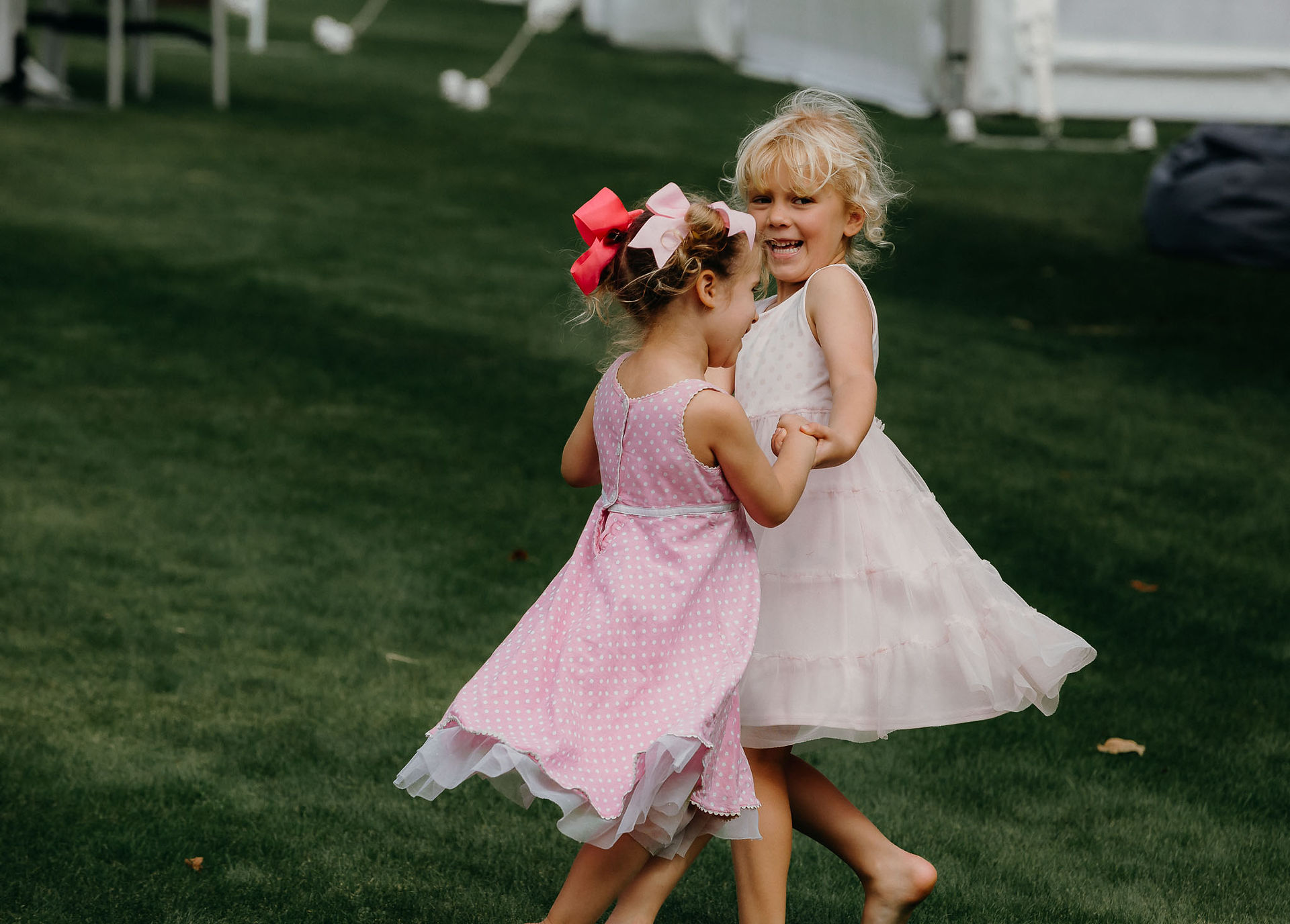 two girls dancing together before the wedding