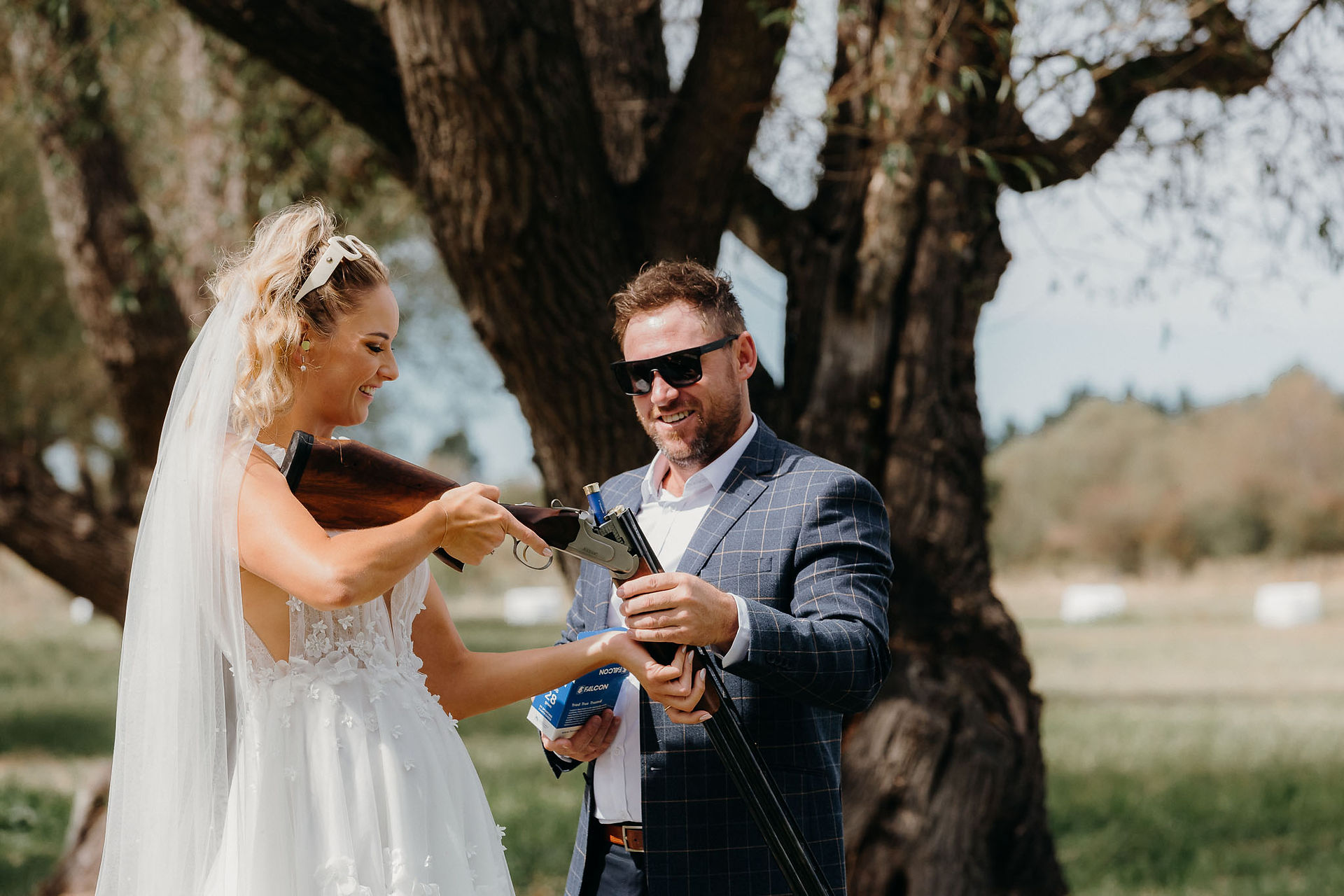 Bride and groom clay bird shooting with their bridal party before the wedding ceremony