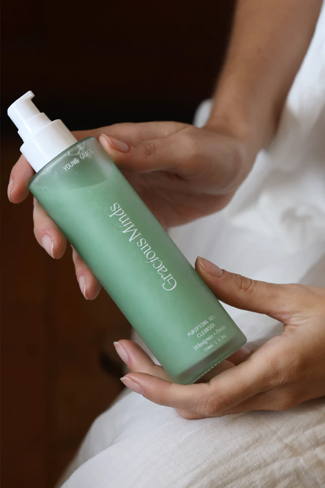 green cleanser in class bottle by Gracious Minds