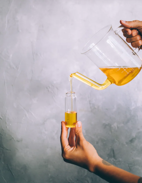 Thumbnail: pouring yellow liquid from a glass teapot to a shot glass