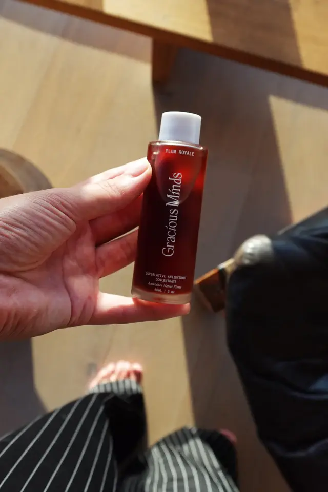 Thumbnail: deep red bottle of gracious mind's plum royale superlative concentrate