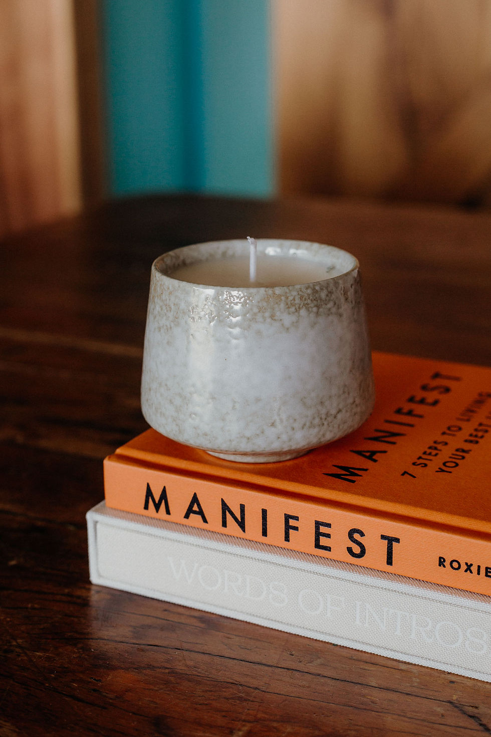 white grey retro vintage candle on books