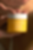 A glass jar of golden-hued 'Herbal Gold' night treatment. Contains Australian Bush Tomato and Turmeric