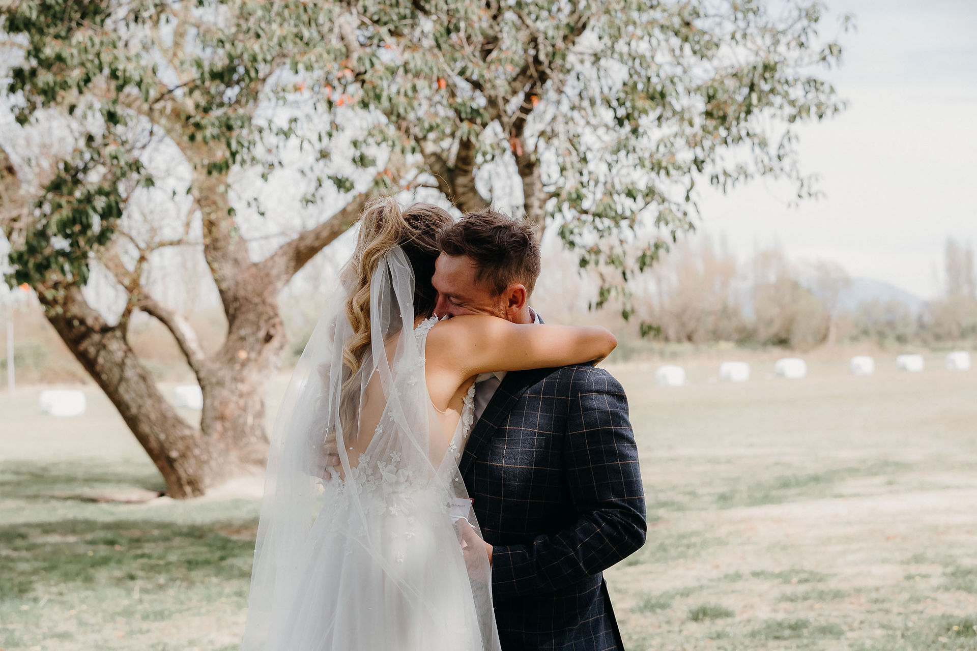 Bride giving the groom a memorial pin before their Canterbury wedding