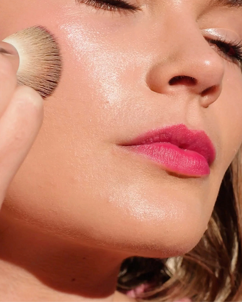 Thumbnail: woman putting on and wearing beetroot lip and cheek tint by Ere Perez