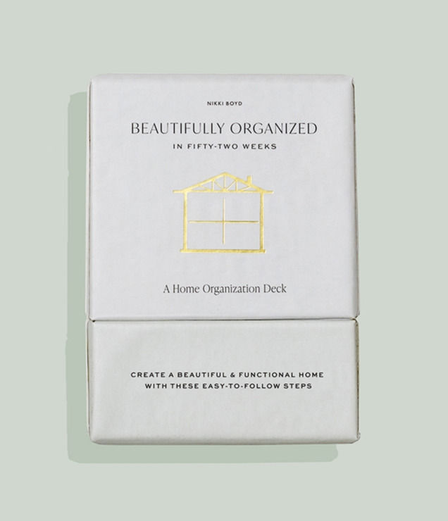 white cover of box with gold foil wording