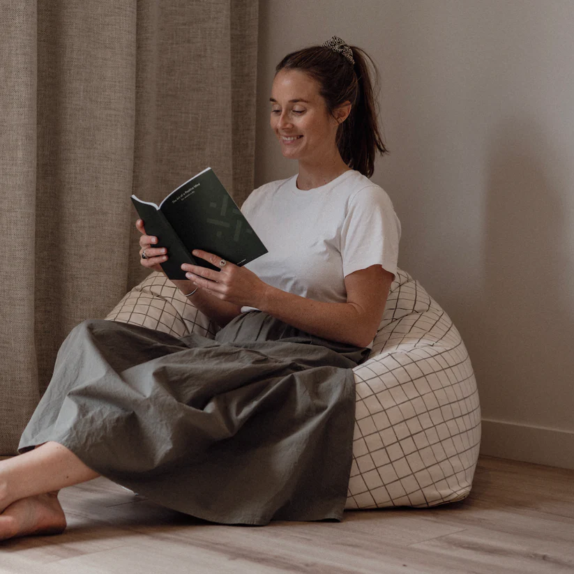 Thumbnail: woman holding the art of a positive mind green covered journal