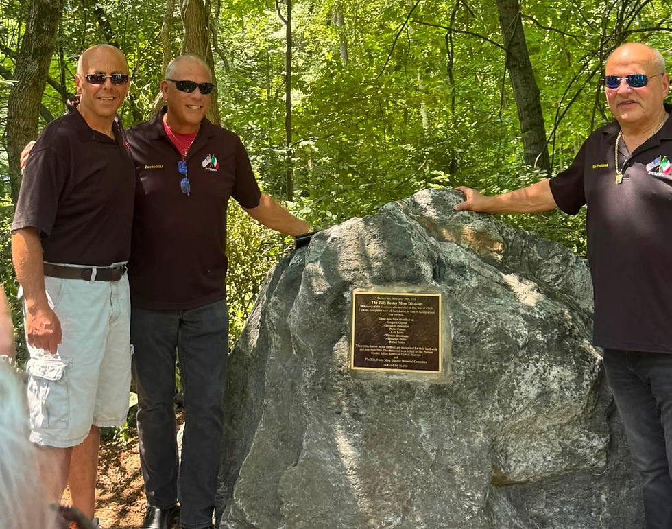Members of the Putnam County Italian American Social Club show off the new monument. Photo by Paul Anthony Fucito.