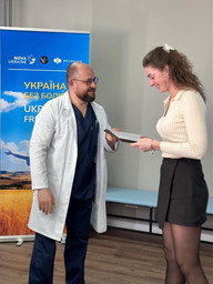 Medical professionals receiving completion certificates for pain syndrome treatment training at Ministry of Internal Affairs Medical Center