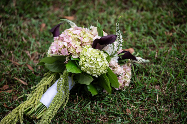 Beautiful bridal bouquet laying on the ground.