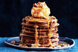Double chocolate pancakes with pecans and caramel sauce