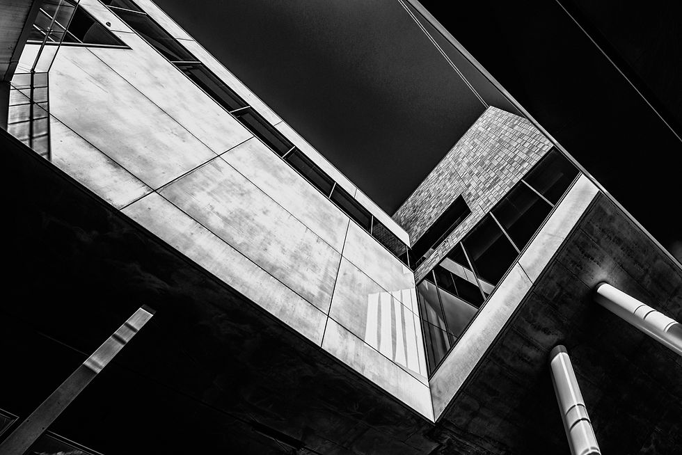 greyscale-low-angle-shot-building-with-cool-design.jpg